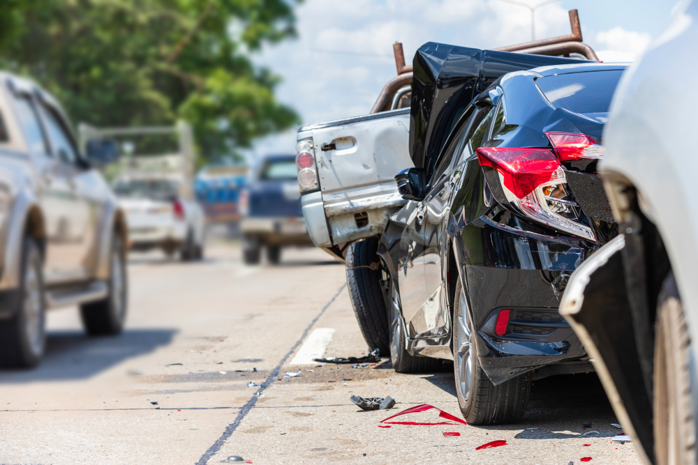 Damaged car after a hit-and-run accident, highlighting the importance of reporting and gathering evidence.